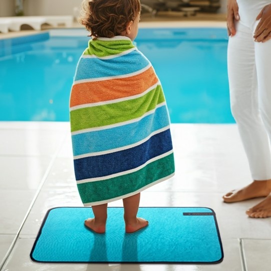 mmaatt small child standing comfortably and safely on teal changing mat